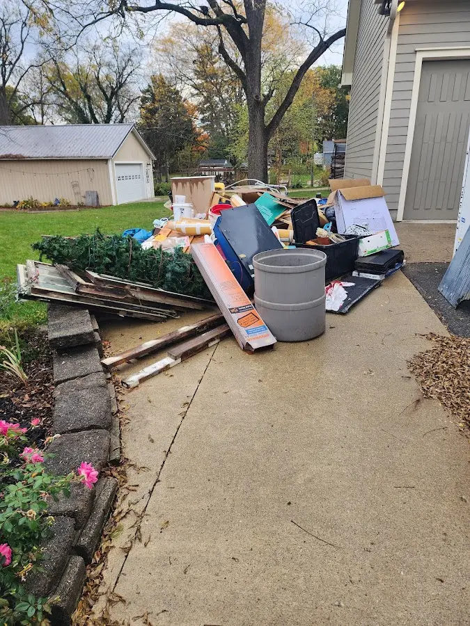 Dumpster being loaded with debris for Demolition Dumpster Rental in Waverly